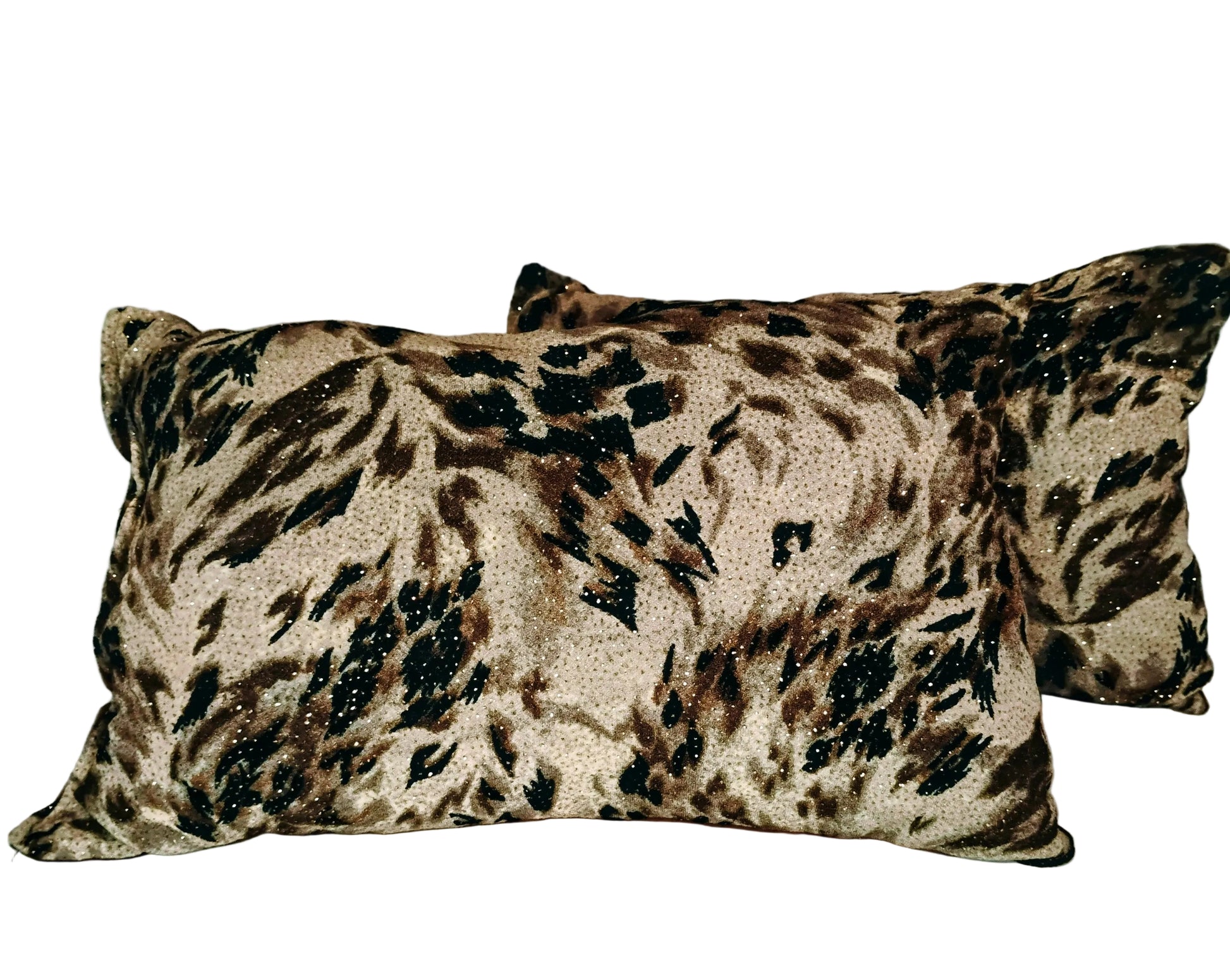 Two leopard print pillows on a white background