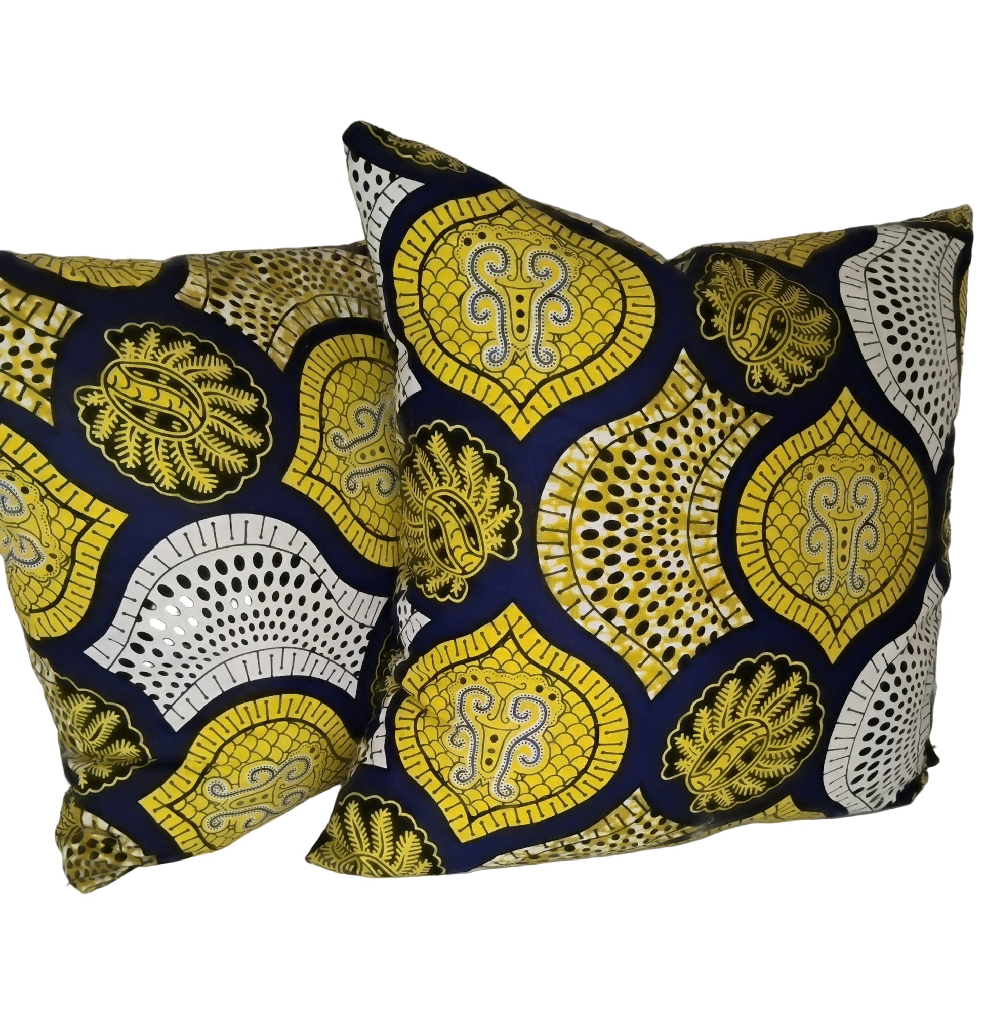 Two decorative pillows with yellow and blue patterns on a white background