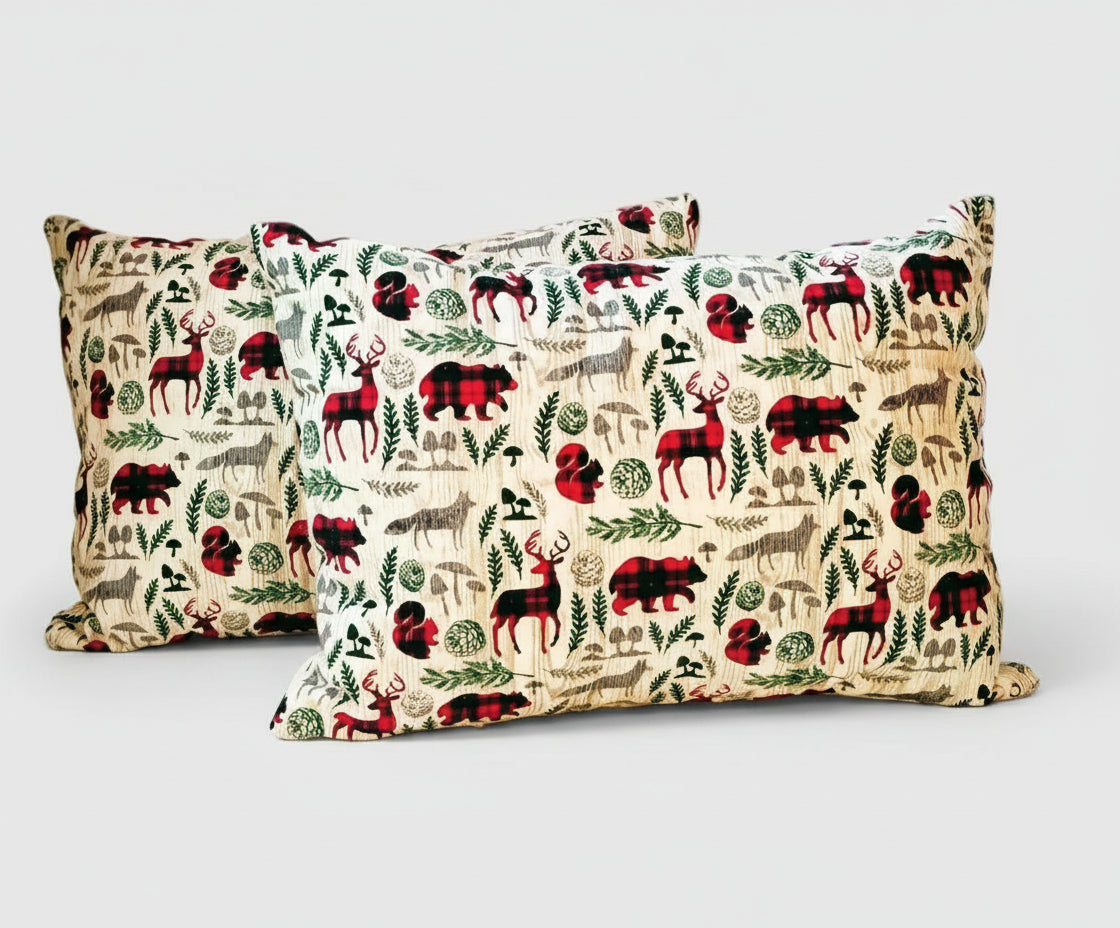Two decorative pillows with animal pattern on a white background