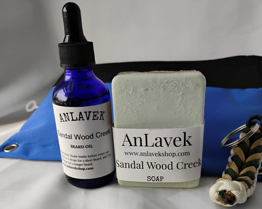 AnLavek sandalwood products including a bottle, dropper, and soap on a white background